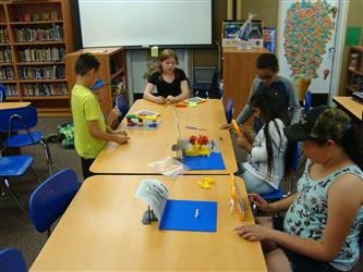 5 students working on a project in class