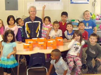 A teacher with a classroom around a table